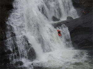 Kayaker going over lower drop of Bald River Falls